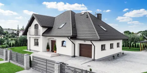 Nowoczesny dom z wielospadowym dachem, prezentujący różne rodzaje dachów.