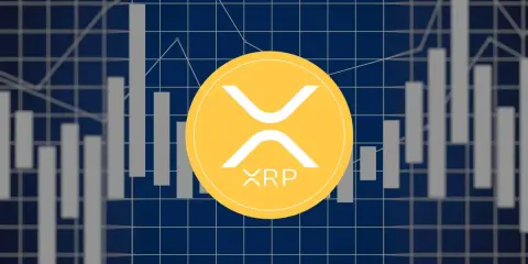 Żółty symbol XRP na tle wykresów giełdowych. Czy to zapowiedź wzrostów? XRP prognozy 2050.