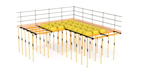 Sistema de encofrado recuperable con soportes naranjas y moldes amarillos para crear losas de hormigón.