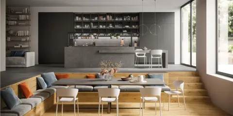 Moderna zona giorno con idee salotto e sala da pranzo insieme. Divano, libreria, cucina a isola e tavolo da pranzo con sedie bianche.