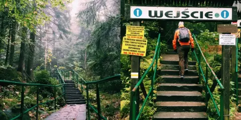 Wędrowiec wspina się po kamiennych schodach do wejścia na teren Szczelińca Wielkiego.
