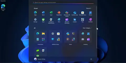 Das Windows 11 Startmenü zeigt angepinnte Apps wie Edge und Word, sowie Kategorien wie Produktivität und Kreativität.