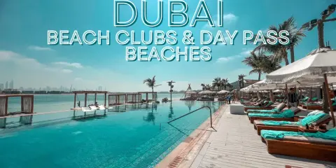Piscina a sfioro e lettini prendisole in un lussuoso beach club di Dubai, con palme e vista sullo skyline.