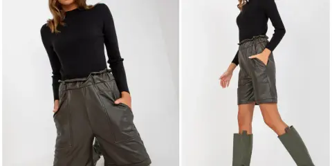 Eleganckie szorty stylizacje: modelka w czarnym swetrze i oliwkowych szortach z wysokim stanem, do tego wysokie kozaki.