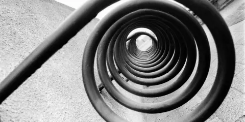 A spiral staircase, reminiscent of Edward Weston's famous photos, draws the eye inward.