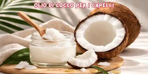 Olio di cocco per capelli: scopri le sue incredibili proprietà. Un vasetto di olio di cocco, un cocco aperto e foglie verdi.