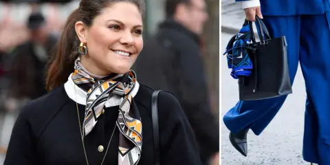 Kronprinsessan Victoria visar hur man snyggt kan knyta scarf runt halsen, matchat med en elegant svart kofta.