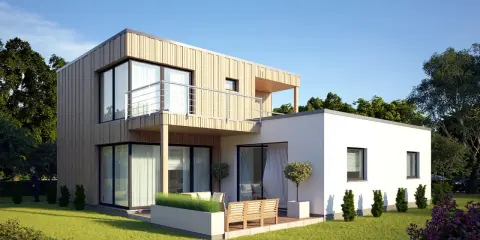 Modernes **Modulbau Haus** mit Holzfassade und Balkon, umgeben von einem gepflegten Garten.