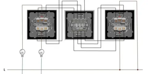 Schemat instalacji elektrycznej z wyłącznikiem krzyżowym, pokazujący połączenia między trzema łącznikami schodowymi, w tym jednym krzyżowym.