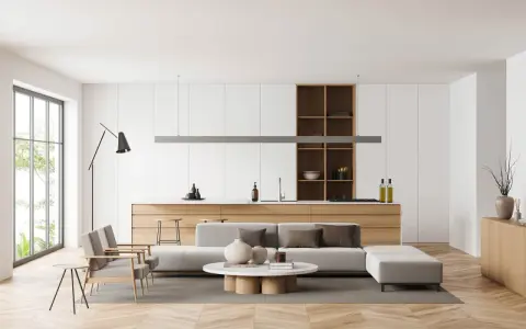 Interni luminosi con divano, tavolino e cucina a vista. Un esempio di come arredare case moderne con stile e funzionalità.