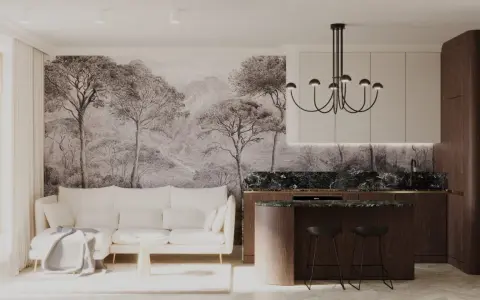 Nowoczesny salon z kuchnią, gdzie ściany zdobią **obrazy w sztukaterii** imitujące leśny krajobraz. Biała kanapa i drewniana wyspa kuchenna tworzą przytulną atmosferę.