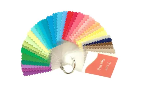 A fan of fabric swatches in various bright colors, with a tag reading "True Spring".