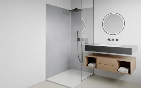 Salle de bain moderne avec douche à l'italienne, receveur discret, meuble vasque suspendu en bois et miroir lumineux.