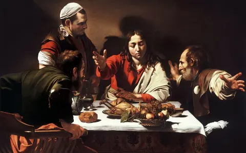 Wieczerza w Emaus Caravaggia: Jezus błogosławi posiłek, a jego towarzysze rozpoznają go w geście zdumienia.