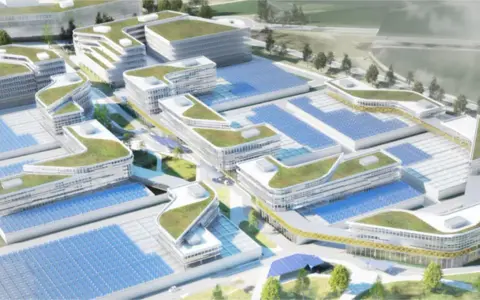 Moderne Gebäude mit begrünten Dächern und Solaranlagen prägen diesen urbanen Lebensraum.