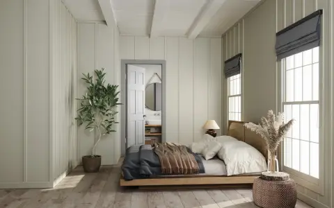 Camera da letto con letto in legno, la sua posizione rispetto alla porta aperta che rivela un bagno.