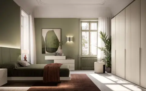 Camera da letto con pareti verdi e un letto accogliente. L'arredamento verde crea un'atmosfera rilassante, con un quadro astratto e un grande armadio bianco.