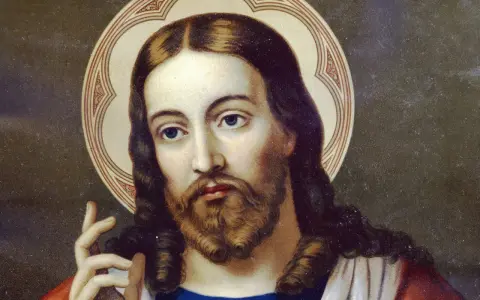 Porträt Jesu Christi mit Heiligenschein, der die Frage "wer ist Gott" in sich trägt.