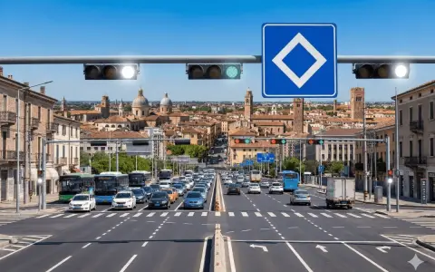 Traffico intenso in città con semaforo verde che indica via libera. Edifici storici sullo sfondo.