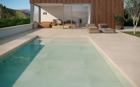 Relájate junto a una piscina con los colores de piscinas modernas, rodeada de un diseño minimalista y vistas a la montaña.