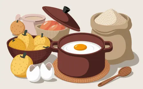 Ingrédients pour une spécialité auvergnate : poires, œufs, farine et une omelette en préparation.
