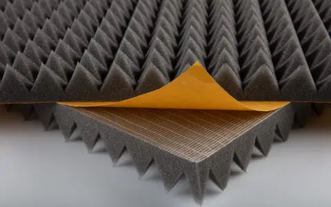 Acoustic foam with a peel-and-stick backing, perfect for learning how to soundproof a room.
