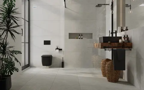Nowoczesna łazienka z czarną armaturą i roślinnością. Eleganckie układanie płytek 120x60 na ścianie tworzy spójną całość.