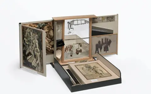 A surreal assemblage of famous drawers, featuring collage, mirrors, and found objects, creating a miniature world of artistic exploration.