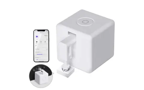 A white cube-shaped device with a robotic arm, paired with a smartphone app, showcasing cool IoT devices for smart home automation.