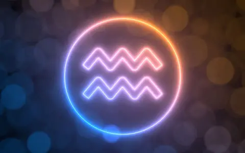 Neonowy symbol Wodnika, od kiedy do kiedy trwa ten znak zodiaku, otoczony poświatą.
