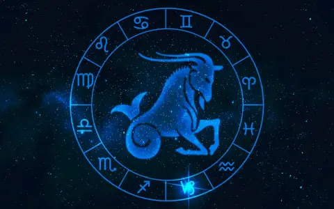 Błękitny koziorożec w centrum zodiaku, otoczony symbolami gwiazd. Byk i koziorożec to znaki zodiaku.