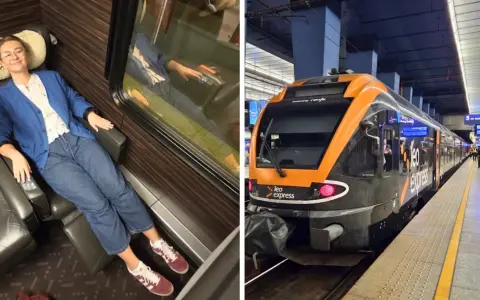 Uśmiechnięta kobieta w wygodnym fotelu w pociągu Leo Express, gotowa na podróż z Pragi do Warszawy.