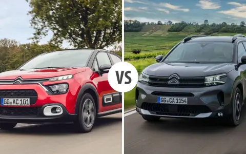 Dwa modele Citroen SUV: czerwony i ciemnoszary, jadące po drodze.