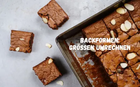 Saftige amerikanische Masse Brownies, frisch aus der Form geschnitten, mit Mandelsplittern verziert.