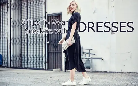 A woman shows how to wear sneakers with a dress, pairing white sneakers with a black midi dress and a clutch.