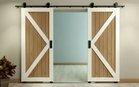 Two white-trimmed, wooden barn doors with black hardware slide open on a black track, showcasing a room beyond. This image illustrates how to install barn door hardware.