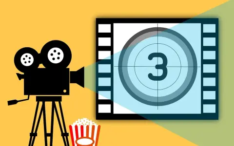 Kamera filmowa, popcorn i plansza z cyfrą 3 – idealne na wieczór z filmami o fotografii.