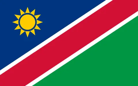 Flaga Namibii z żółtym słońcem. Marzysz o podróży? Sprawdź, czy potrzebna jest namibia wiza.