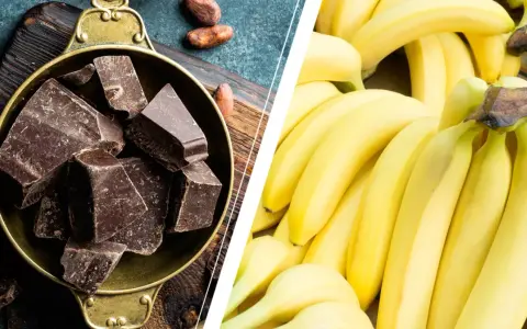 Dark chocolate chunks in a bowl and a pile of ripe bananas.