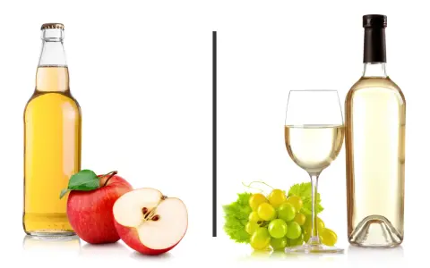 Jabłkowy drink czy białe wino? Po lewej butelka z jabłkowym napojem i jabłka, po prawej kieliszek i butelka białego wina z winogronami.