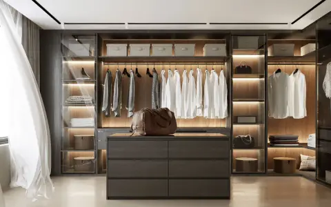 Un dressing moderne et organisé, parfait pour savoir comment ranger son dressing. Chemises blanches suspendues, tiroirs sombres et sacs en cuir.