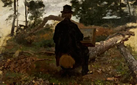 Un peintre hollandais du 20ème siècle, chapeau sur la tête, peint en plein air, assis sur une souche au milieu d'une forêt.