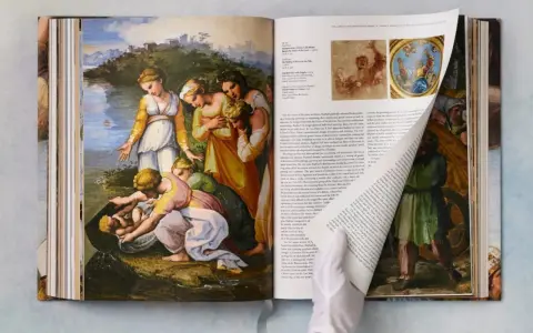 Obras de arte de Rafael Sanzio, como "El hallazgo de Moisés", en un libro abierto.