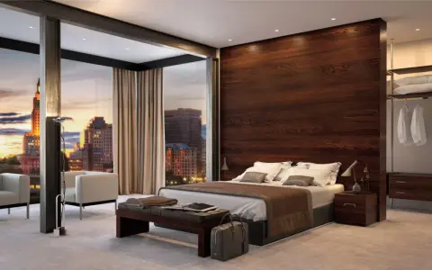 Moderna camera da letto con parete dietro letto idee in legno scuro, vista panoramica sulla città al tramonto.