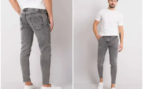 Szare jeansy męskie z przetarciami, dopasowane, z białym t-shirtem i białymi slip-onami.