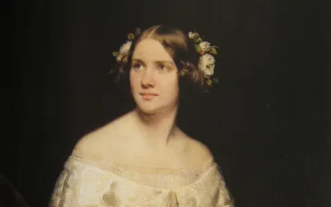 Porträtt av en ung kvinna med blommor i håret, kanske en ung Jenny Lind.