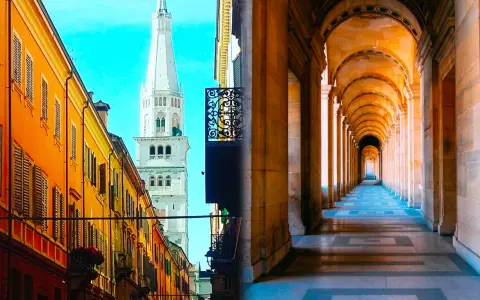 Split image: Left shows a street in Modena with colorful buildings and a tall white tower. Right shows a long, arched colonnade, evoking Bologna's porticoes.
