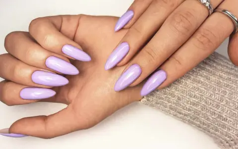 Beautiful lavender acrylic nails, a stylish choice that proves acrylic doesn't have to be expensive.