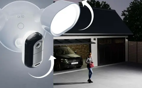 Arlo-kameran med lokal lagring lyser upp en uppfart där en kvinna närmar sig garaget med en bil.