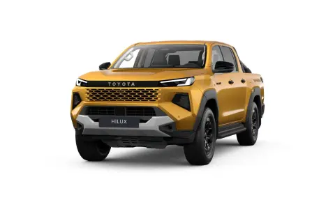 Złoty Toyota Hilux, nowy model pickup, z charakterystycznym grillem i nowoczesnymi światłami. Gotowy na każdą przygodę.